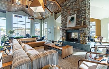 Resident lounge with kitchen, dining space and fireplace